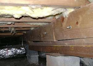 sagging crawl space with wooden shimming a Bryson crawl space